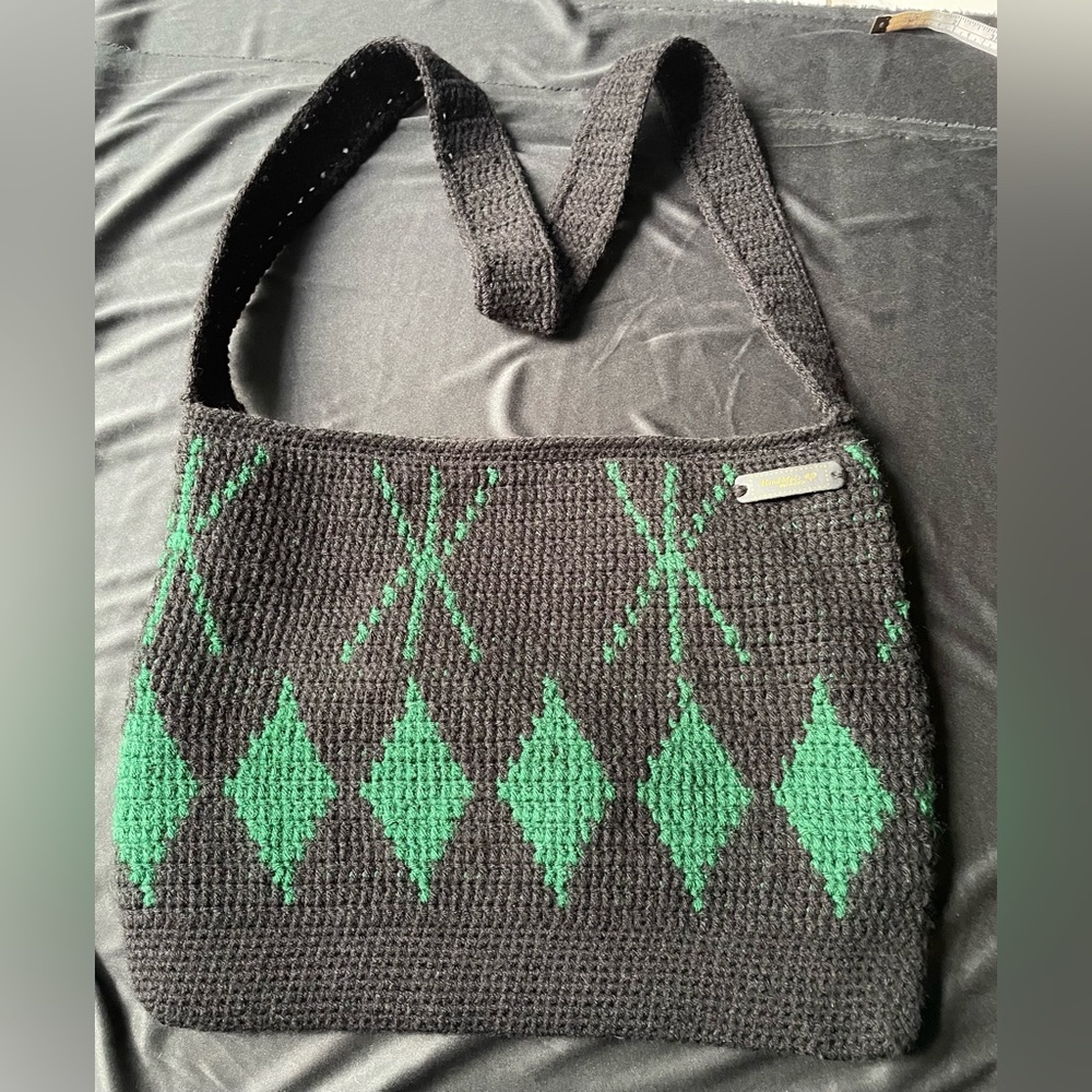 Hand made crocheted crossbody bag. Black and green.